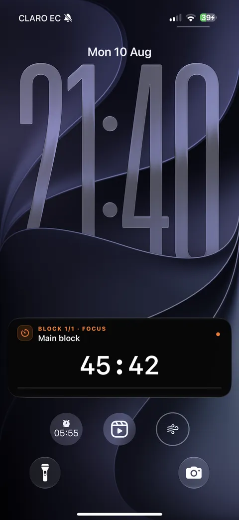 An iPhone Lock Screen showing the Focus Tycoon Live Activity: Block 1 of 1 · Focus · Main block · 45:42 remaining.